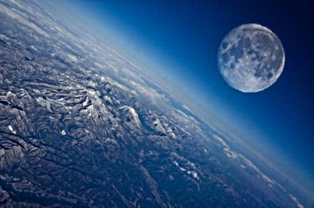 Moon above earth - both, atmosphere, mountains, surface