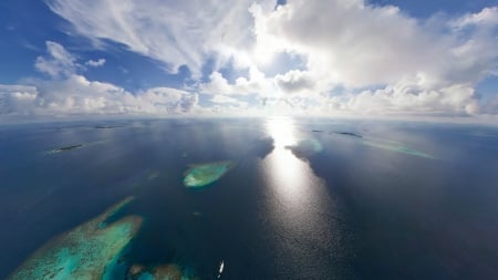 fantastic view of an ocean reef on a sunny day - ocean, view, ship, sunshine, clouds, islands, reef