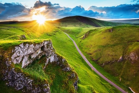 Winnats Pass, Derbyshire - roads, beautiful, hills, yellow, grass, sun rays, blue, sky, clouds, limestone pinnacles, england, sunrise, green