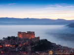 superb castle on a hill above morning fog