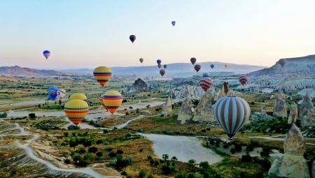 Hot Air Balloons - lake, sky, landscape, air, hot, water, field, mountains, nature, balloons, brown, bunch, green, colors