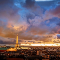 fantastic view of paris on a cloudy sunset