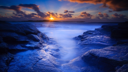 sunrise over blue rocky seashore - clouds, shore, sea, sunrise, misr, rocks