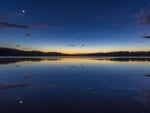 moon over lake at dusk