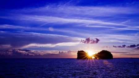 sunset through an ocean rock island - clouds, trees, sunset, rock, portal, island, sea