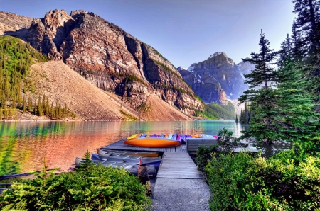 Moraine lake - dock, quiet, reflection, calmness, emerald, moraine, lake, boats, mountain, hills, summer, shore, lovely, serenity, nature, pier, beautiful, waters