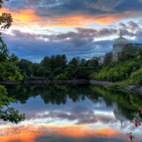 beautiful church near a pond at sunset