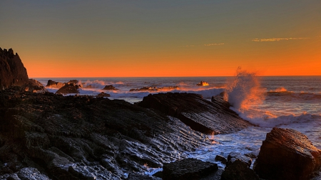 splashing waves on a rocky shore at sunset - shore, sunset, waves, sea, splash, rocks