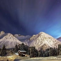 mountain cabins in winter at night