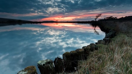 wooden pillars on a lake shore at twilight - lake, reflection, clouds, pillars, twilight, shore