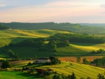 beautiful farm house amid fields on hills