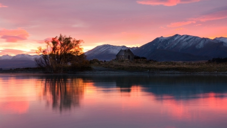 stone lake house in a pink sunrise - lake, pink, reflection, house, stone, sunrise, shore