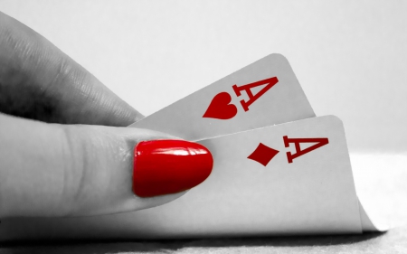 Two colors - paper, red nail, red and black, hand, close-up