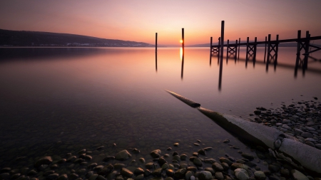 lake pier at sunset - shore, sunset, lake, posts, stones, pier