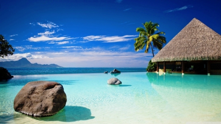 Bungalow in blue ocean water - summer, coast, blue, beach, landscape, scene, sand, shore, exotic, tropic, sky, clouds, water, sea, HD, ocean, nature, waves, wallpaper