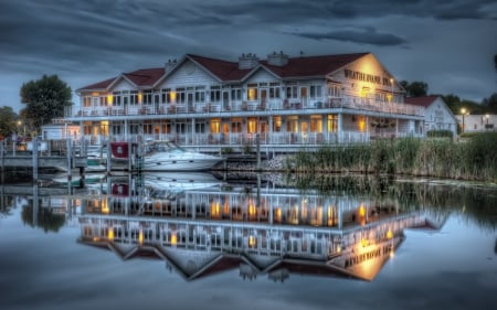 Weathervane Inn, Montague, Minnesota - weathervane, lights, water, night, inn, lake, sky, minnesota, architecture, building, reflection, clouds, montague, windows, boats