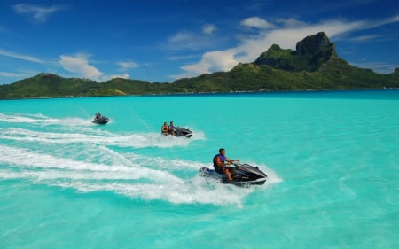 jet skiing - sky, sunshine, beach, people, paradise, sun, coast, vacation, clouds, holiday, tropic, skyphoenixx1, ocean, summer, tropical, jet skiing, shore, isle, waves, nature, jet ski, island, sea