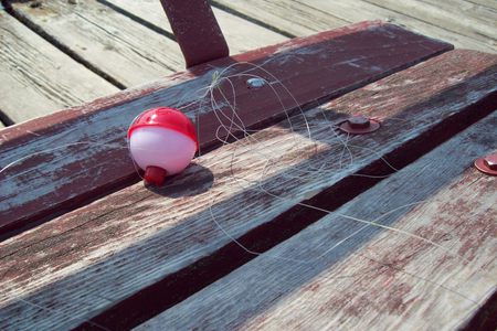 Bobber left behind - nature, wood, fishing, outdoors