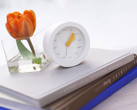 On the bedside table - vase, bedside table, clock, books, tulip