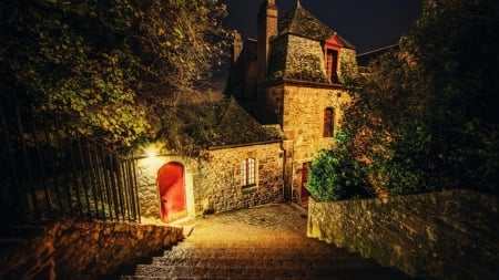 steps outside a stone house at night - stone, hill, trees, night, steps, house, lights