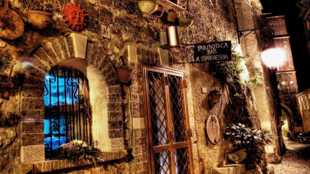 outside a bar in an italian town at night - street, lights, city, night, stones, bar