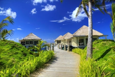 Tropical paradise - sky, beach, paradise, hotel, vacation, clouds, grass, resort, bungalow, ocean, palms, summer, tropical, huts, exotic, nature, pier, beautiful, rest, breeze, sea