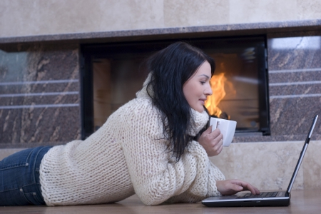 Relaxing by the Fire - woman, fireplace, coffee, laptop