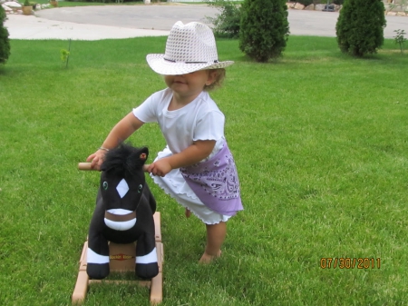 Cowgirl And Her Stuffed Horse - hat, cowgirl, little girl, lawn, horse