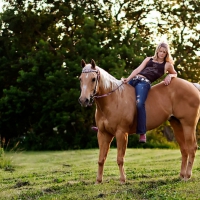 Blonde Cowgirl on horse