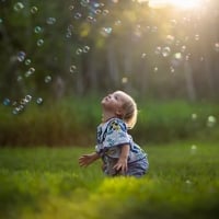 A child blowing bubbles