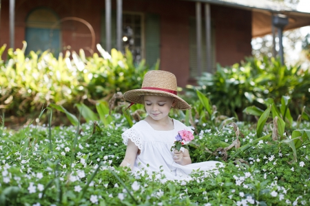 Picking Flowers For Mom - hat, people, girl, strawhat, nature, white, person, pink, blue, bunch, leaves, green, house, flowers, little