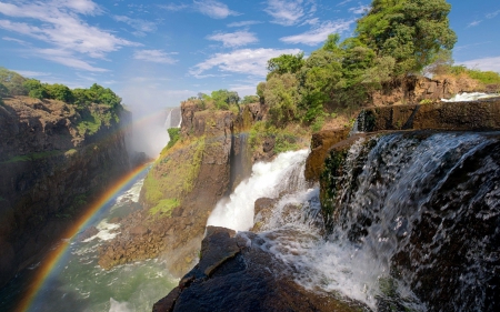 Rainbow over Zambezi River and Victoria Falls - waterfalls, rainbows, nature, rivers