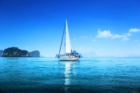 sailboat - ocean, sky, sail, skyphoenixx1, hills, water, summer, sailing, rocks, vacation, ship, clouds, holiday, sea, boat