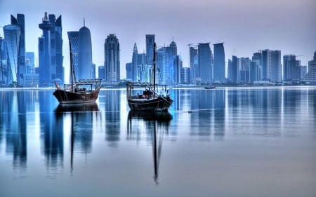 RESTING BOATS - calm, boats, river, city, buildings