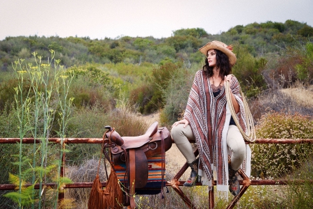 Cowgirl In A Poncho - women, girls, fun, models, hat, female, cowgirl, cowgirls, hats, western, poncho, saddles, style, fence, fashion, boots, ranch