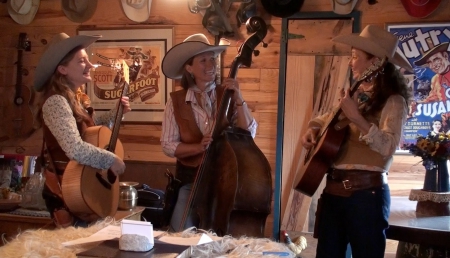 Cowgirl Musicians - musicians, flowers, vase, hats, cowgirls, pictures, guns, poster, table, guitars