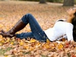 Autumn Cowgirl In Leaves