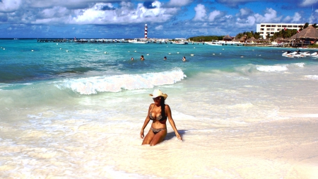 Cowgirl On A Busy Beach - surf, girls, women, hats, cowgirls, outdoors, sand, sky, men, vacation, resorts, fun, beaches, sea