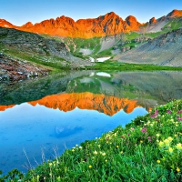 LAKE at SUNRISE in SAN JUAN MOUNTAINS with FLOWERS