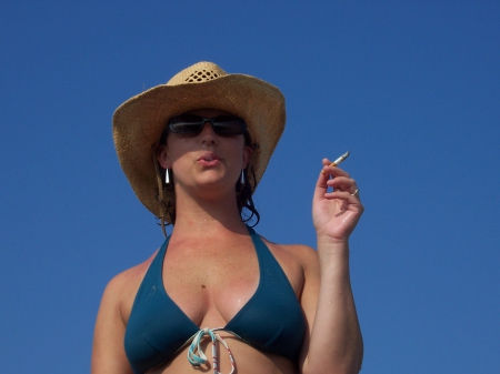 Smoking Gun - hat, cowgirl, blue sky, smoking