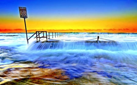 TIDE OVER the PIER - beaches, sky, blue and golden shades, sun, paradise, sunset, evening, clouds, seashore, sunrays, enchanting nature, tropical paradise, ocean, wave, waves, nature, pier, splendor, tide