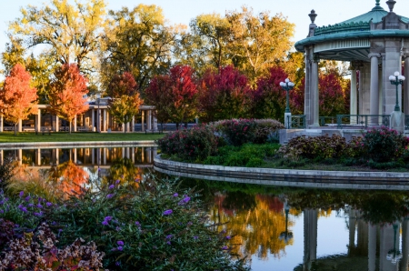 Autumn Park - autumn, trees, water, gazebo, bushes, lamp posts, fall, benches, reflection, flowers, pond