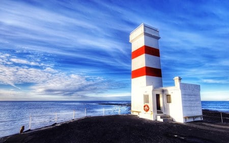 Alone in Winter  - shore, coast, lighthouse, iceland, sky