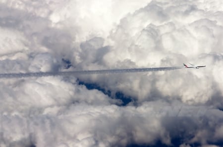 Boeing 777-31H/ER - contrails, boeing, commercial, clouds