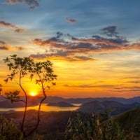 peaks rising to the sunset