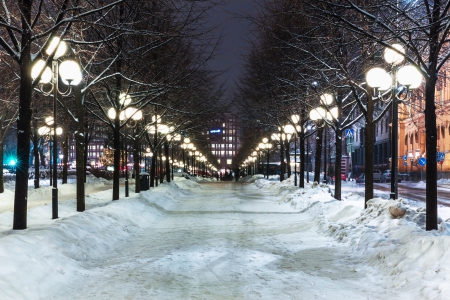 Winter Town - trees, cars, winter, town, evening, road, snow, post, city, buildings, sweden, lights, street lights, signs, sky, lamps