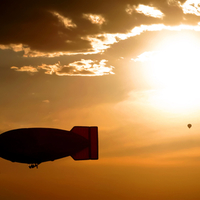 Blimp Silhouette and Hot Air Balloon