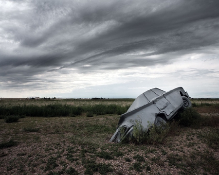 LONG LOST CAR - dark clouds, car, field, abandon, wreck, grass