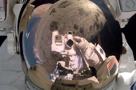 Astronaut Stephen Robinson repairs damage to Space Shuttle - Astronaut, Camera, Space Shuttle, Repair