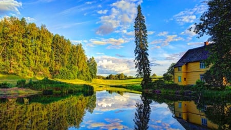 Countryside Reflection - clouds, house, trees, summer, lagoon, blue, pond, beautiful, shrubs, reflection, field, green grass